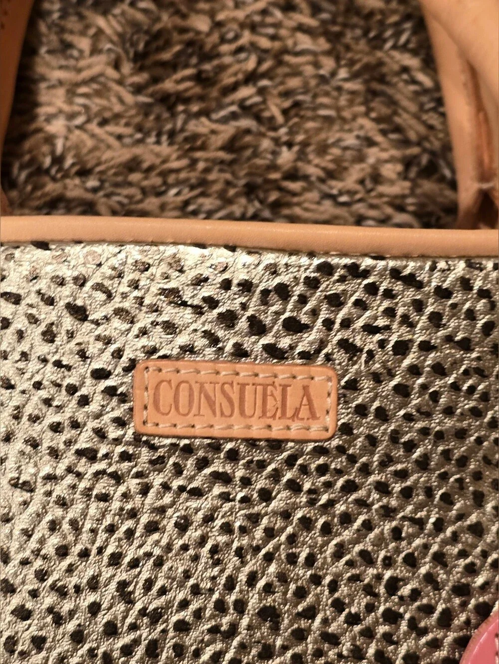 Consuela Tommy Satchel With a textured gold exterior & natural leather handles